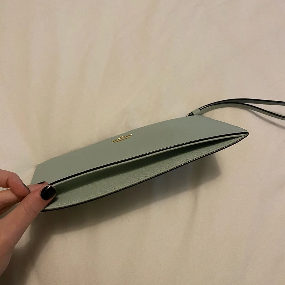 kate spade mint green wristlet clutch with gold logo